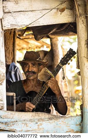 "Sugar cane farmer playing the guitar, Valle de los Ingenios, Trinidad, Sancti Spiritus Province, Cuba, North America" View Large Photo Image Stock Image - "Sugar cane farmer playing the guitar, Valle de los Ingenios, Trinidad, Sancti Spiritus Province, Cuba, North America". Fotosearch