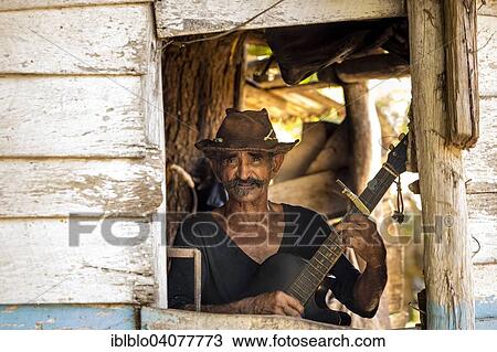 "Sugar cane farmer playing the guitar, Valle de los Ingenios, Trinidad, Sancti Spiritus Province, Cuba, North America" View Large Photo Image Stock Image - "Sugar cane farmer playing the guitar, Valle de los Ingenios, Trinidad, Sancti Spiritus Province, Cuba, North America". Fotosearch