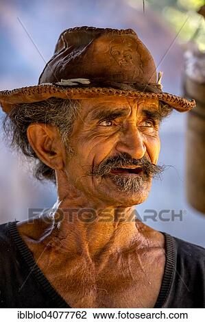 "Sugar cane farmer wearing a hat, portrait, Valle de los Ingenios, Trinidad, Sancti Spiritus Province, Cuba, North America" View Large Photo Image Stock Image - "Sugar cane farmer wearing a hat, portrait, Valle de los Ingenios, Trinidad, Sancti Spiritus Province, Cuba, North America". Fotosearch