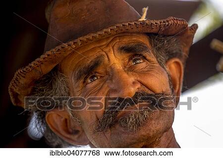 Stock Photo - "Sugar cane farmer wearing a hat, portrait, Valle de los Ingenios, Trinidad, Sancti Spiritus Province, Cuba, North America". Fotosearch