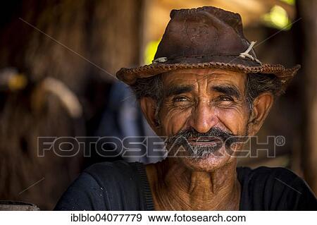 "Sugar cane farmer wearing a hat, portrait, Valle de los Ingenios, Trinidad, Sancti Spiritus Province, Cuba, North America" View Large Photo Image Stock Photo - "Sugar cane farmer wearing a hat, portrait, Valle de los Ingenios, Trinidad, Sancti Spiritus Province, Cuba, North America". Fotosearch