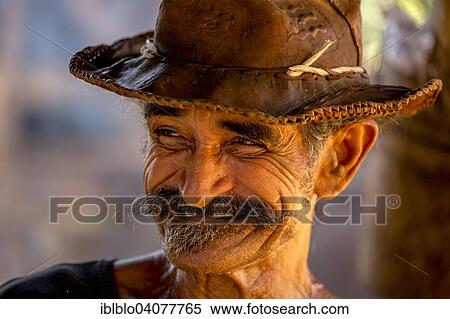 "Sugar cane farmer wearing a hat, portrait, Valle de los Ingenios, Trinidad, Sancti Spiritus Province, Cuba, North America" View Large Photo Image Stock Photography - "Sugar cane farmer wearing a hat, portrait, Valle de los Ingenios, Trinidad, Sancti Spiritus Province, Cuba, North America". Fotosearch