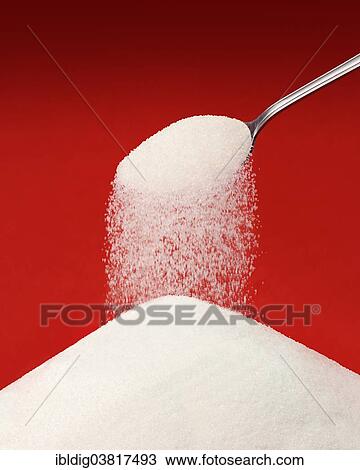Sugar falling from a spoon View Large Photo Image Stock Image - Sugar falling from a spoon. Fotosearch
