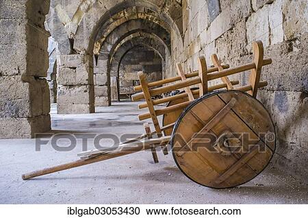 Stock Image - "Sultanhani caravanserai on the former silk road, ancient wooden cart, Sultanhani, Anatolia, Turkey, Asia". Fotosearch
