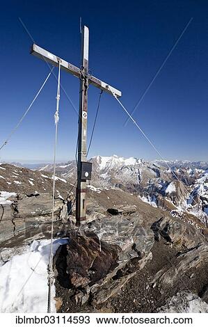 "Summit cross of Wilden Kreuzspitze Mountain in the Pfunderer Mountains, Hochfeiler Mountain at the rear, Wilde Kreuzspitze, South Tyrol province, Trentino-Alto Adige, Italy, Europe" View Large Photo Image Stock Image - "Summit cross of Wilden Kreuzspitze Mountain in the Pfunderer Mountains, Hochfeiler Mountain at the rear, Wilde Kreuzspitze, South Tyrol province, Trentino-Alto Adige, Italy, Europe". Fotosearch