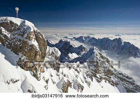 Stock Photograph - "Summit cross of Zugspitze Mountain, Zugspitze, Wetterstein mountain range, Eastern Alps, Upper Bavaria, Bavaria, Germany, Europe". Fotosearch