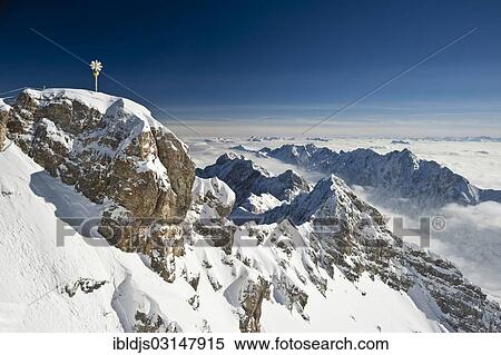 Stock Photography - "Summit cross of Zugspitze Mountain, Zugspitze, Wetterstein mountain range, Eastern Alps, Upper Bavaria, Bavaria, Germany, Europe". Fotosearch