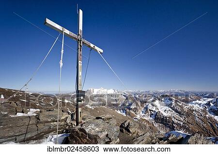 "Summit cross on the summit of Wilden Kreuzspitze Mountain in the Pfunderer Mountains, looking towards Hochfeiler Mountain, Alto Adige, Italy, Europe" View Large Photo Image Stock Image - "Summit cross on the summit of Wilden Kreuzspitze Mountain in the Pfunderer Mountains, looking towards Hochfeiler Mountain, Alto Adige, Italy, Europe". Fotosearch