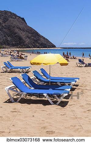 "Sun beds and a parasol on the sandy beach of Playa de las Teresitas, San Andres, La Montanita, Tenerife, Canary Islands, Spain, Europe" View Large Photo Image Stock Photo - "Sun beds and a parasol on the sandy beach of Playa de las Teresitas, San Andres, La Montanita, Tenerife, Canary Islands, Spain, Europe". Fotosearch
