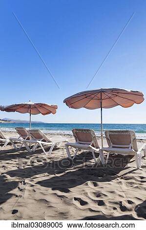 "Sun beds and sunshades on the beach, Costa Calma, Fuerteventura, Canary Islands, Spain, Europe" View Large Photo Image Stock Photography - "Sun beds and sunshades on the beach, Costa Calma, Fuerteventura, Canary Islands, Spain, Europe". Fotosearch