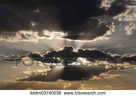 "Sun behind clouds, Botswana, Africa" View Large Photo Image Stock Photo - "Sun behind clouds, Botswana, Africa". Fotosearch