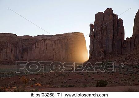 "Sun behind sandstone formations, Monument Valley Navajo Tribal Park, Utah, United States, North America" View Large Photo Image Stock Image - "Sun behind sandstone formations, Monument Valley Navajo Tribal Park, Utah, United States, North America". Fotosearch
