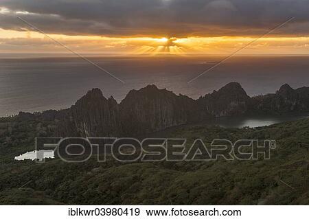 "Sun breaking through the clouds over the South Pacific behind the Linderalique Rocks, Hienghene, North Province, Grande Terre, New Caledonia, Oceania" View Large Photo Image Stock Photo - "Sun breaking through the clouds over the South Pacific behind the Linderalique Rocks, Hienghene, North Province, Grande Terre, New Caledonia, Oceania". Fotosearch