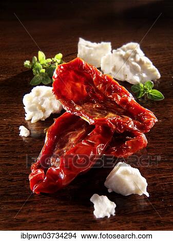 Sun dried tomatoes with feta cheese and oregano View Large Photo Image Picture - Sun dried tomatoes with feta cheese and oregano. Fotosearch