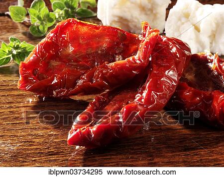 Sun dried tomatoes with feta cheese and oregano View Large Photo Image Stock Photography - Sun dried tomatoes with feta cheese and oregano. Fotosearch