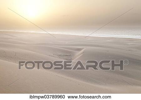 "Sun in the mist of the sea above the sand dunes on Praia de Chaves Beach, on the west coast of the island of Boa Vista, Cape Verde, Republic of Cabo Verde, Africa" View Large Photo Image Stock Image - "Sun in the mist of the sea above the sand dunes on Praia de Chaves Beach, on the west coast of the island of Boa Vista, Cape Verde, Republic of Cabo Verde, Africa". Fotosearch