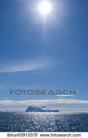 "Sun shining over an iceberg, Cierva Cove, Chavdar Peninsula, Antarctica" View Large Photo Image Stock Photo - "Sun shining over an iceberg, Cierva Cove, Chavdar Peninsula, Antarctica". Fotosearch