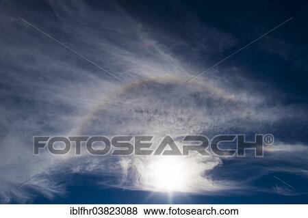 "Sun with a halo in the blue sky with white clouds, Gran Canaria, Canary Islands, Spain, Europe" View Large Photo Image Stock Photo - "Sun with a halo in the blue sky with white clouds, Gran Canaria, Canary Islands, Spain, Europe". Fotosearch