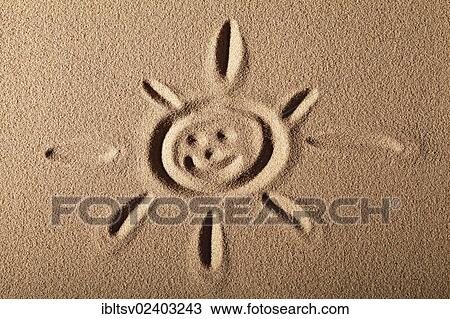 Sun with face painted in the sand View Large Photo Image Stock Image - Sun with face painted in the sand. Fotosearch