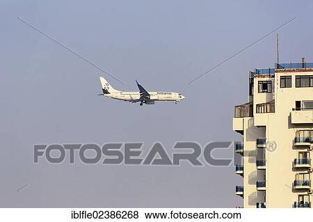 Stock Photo - "SunExpress Boeing 737-500 passenger airline on the landing approach to Antalya, Turkish Riviera, Turkey, Asia". Fotosearch