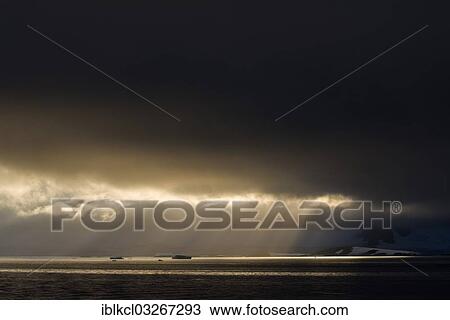 "Sunlight shining through a hole in the clouds, Errera Channel, Arctowski Peninsula, Antarctic Peninsula, Antarctica" View Large Photo Image Stock Image - "Sunlight shining through a hole in the clouds, Errera Channel, Arctowski Peninsula, Antarctic Peninsula, Antarctica". Fotosearch