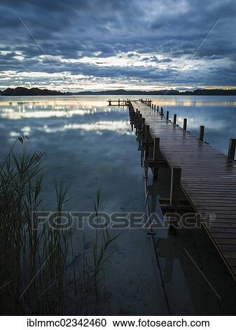Stock Image - "Sunrise at Lake Woerthsee, Bavaria, Germany, Europe". Fotosearch