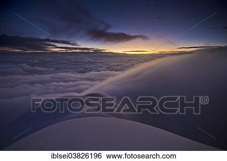 Stock Photograph - "Sunrise at the summit of Cotopaxi Volcano, Quito, Ecuador, South America". Fotosearch