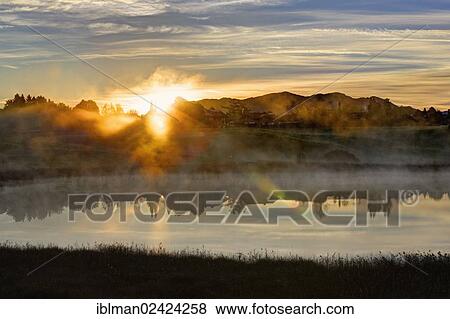 Sunrise on lake Sengsee, Osterseen lakes, Iffeldorf, Fuenfseenland region, Upper Bavaria, Bavaria, Germany, Europe View Large Photo Image Stock Photo - Sunrise on lake Sengsee, Osterseen lakes, Iffeldorf, Fuenfseenland region, Upper Bavaria, Bavaria, Germany, Europe. Fotosearch