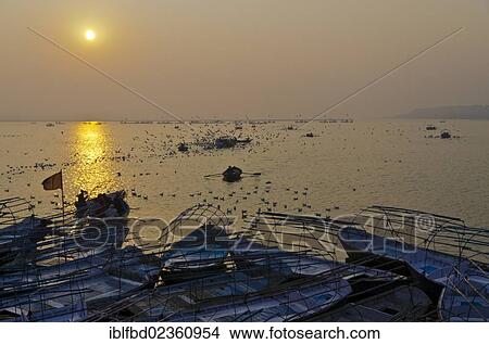 "Sunrise over boats with pilgrims at Sangam, the confluence of the holy rivers Ganges, Yamuna and Saraswati in Allahabad, India, Asia" View Large Photo Image Picture - "Sunrise over boats with pilgrims at Sangam, the confluence of the holy rivers Ganges, Yamuna and Saraswati in Allahabad, India, Asia". Fotosearch