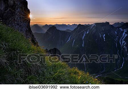 Stock Image - "Sunrise over the Lechtal Alps, Lech valley, Kaisers, Reutte District, Tyrol, Austria, Europe". Fotosearch