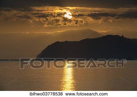 "Sunrise over the Tyrrhenian Sea, behind the Capo Tindari mountains, San Giorgio, Messina province, Sicily, Italy Province" View Large Photo Image Stock Photo - "Sunrise over the Tyrrhenian Sea, behind the Capo Tindari mountains, San Giorgio, Messina province, Sicily, Italy Province". Fotosearch