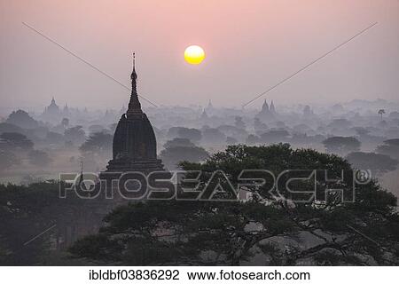 "Sunrise, temples in the morning mist, stupas and pagodas in the temple complex of the Plateau of Bagan, Mandalay Division, Myanmar or Burma" View Large Photo Image Stock Image - "Sunrise, temples in the morning mist, stupas and pagodas in the temple complex of the Plateau of Bagan, Mandalay Division, Myanmar or Burma". Fotosearch
