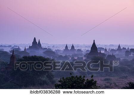 "Sunrise, temples in the morning mist, stupas and pagodas in the temple complex of the Plateau of Bagan, Mandalay Division, Myanmar or Burma" View Large Photo Image Stock Photo - "Sunrise, temples in the morning mist, stupas and pagodas in the temple complex of the Plateau of Bagan, Mandalay Division, Myanmar or Burma". Fotosearch
