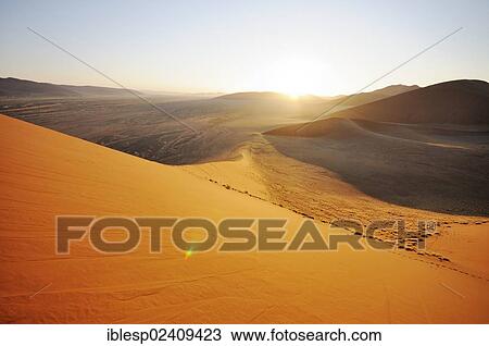 "Sunrise view from Dune 45 on a desert landscape with dunes, Tsauchab-Tal, Sossusvlei, Namib-Naukluft-Park, Namib-Wuste, Namibia, Africa" View Large Photo Image Stock Image - "Sunrise view from Dune 45 on a desert landscape with dunes, Tsauchab-Tal, Sossusvlei, Namib-Naukluft-Park, Namib-Wuste, Namibia, Africa". Fotosearch