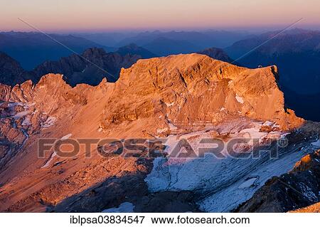 "Sunrise view from Mt Zugspitze to Mt Schneefernerkopf, towards Tyrol, Zugspitzplatt, high karst plateau, Wetterstein Range, Werdenfelser Land, Upper Bavaria, Bavaria, Germany, Europe" View Large Photo Image Stock Photo - "Sunrise view from Mt Zugspitze to Mt Schneefernerkopf, towards Tyrol, Zugspitzplatt, high karst plateau, Wetterstein Range, Werdenfelser Land, Upper Bavaria, Bavaria, Germany, Europe". Fotosearch