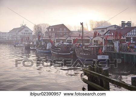 "Sunrise with mist at Wiecker Bridge and harbour, Wieck district, Greifswald, Mecklenburg-Western Pomerania, Germany, Europe" View Large Photo Image Stock Photo - "Sunrise with mist at Wiecker Bridge and harbour, Wieck district, Greifswald, Mecklenburg-Western Pomerania, Germany, Europe". Fotosearch
