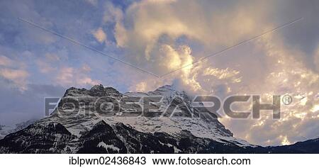 "Sunset and clouds over the summit of the North Face of Eiger mountain, Switzerland, Europe" View Large Photo Image Stock Image - "Sunset and clouds over the summit of the North Face of Eiger mountain, Switzerland, Europe". Fotosearch
