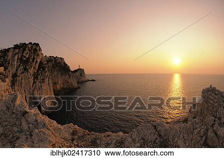 Sunset at cape with lighthouse, Lefkas or Lefkada, Greece, Europe View Large Photo Image Stock Image - Sunset at cape with lighthouse, Lefkas or Lefkada, Greece, Europe. Fotosearch
