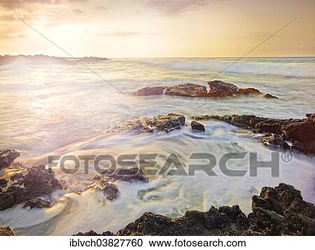 Stock Image - "Sunset at Makalawena Bay, Keauhou, Big Island, Hawaii, United States, North America". Fotosearch