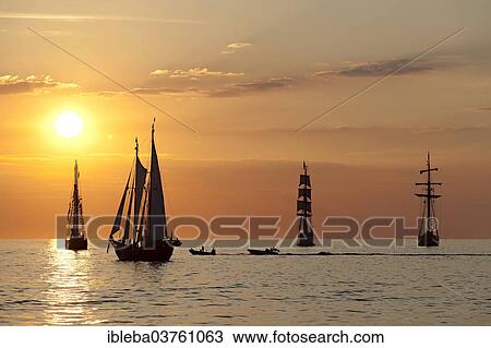 "Sunset at the Hanse Sail 2013, Baltic Sea near the entrance to the port, Warnemunde, Rostock, Mecklenburg-Western Pomerania, Germany, Europe" View Large Photo Image Stock Image - "Sunset at the Hanse Sail 2013, Baltic Sea near the entrance to the port, Warnemunde, Rostock, Mecklenburg-Western Pomerania, Germany, Europe". Fotosearch