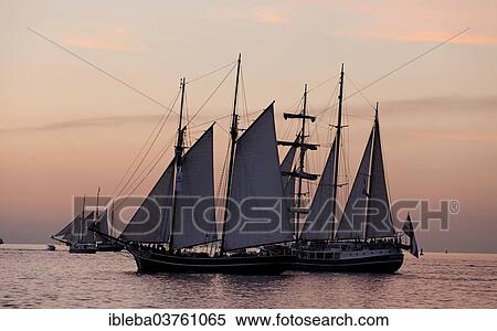 "Sunset at the Hanse Sail 2013, Baltic Sea near the entrance to the port, Warnemunde, Rostock, Mecklenburg-Western Pomerania, Germany, Europe" View Large Photo Image Stock Photography - "Sunset at the Hanse Sail 2013, Baltic Sea near the entrance to the port, Warnemunde, Rostock, Mecklenburg-Western Pomerania, Germany, Europe". Fotosearch