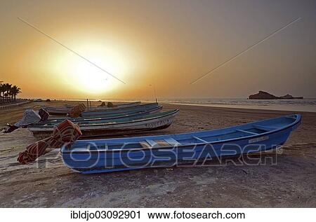 "Sunset in Al Sawadi behind a couple of fishing boats, Al Sawadi, Al Batinah, Oman, Asia" View Large Photo Image Stock Image - "Sunset in Al Sawadi behind a couple of fishing boats, Al Sawadi, Al Batinah, Oman, Asia". Fotosearch