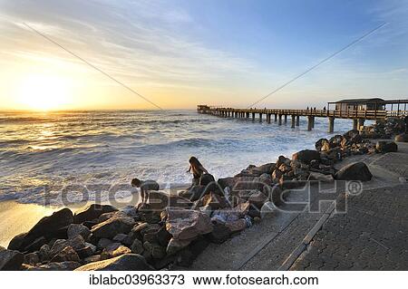 "Sunset on the 325 meter long wooden jetty in Swakopmund, Namibia, Africa" View Large Photo Image Stock Image - "Sunset on the 325 meter long wooden jetty in Swakopmund, Namibia, Africa". Fotosearch