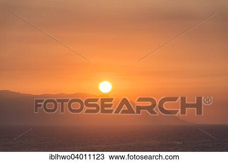 Stock Image - "Sunset on the Greek island of Samos, Ionian coast, Aegean Region, Turkmen Mh., Kusadasi, Aydin province, Turkey, Asia". Fotosearch