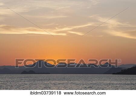 "Sunset on the west coast of Flores Island, Komodo, Nusa Tenggara Timur, Indonesia, Asia" View Large Photo Image Stock Photo - "Sunset on the west coast of Flores Island, Komodo, Nusa Tenggara Timur, Indonesia, Asia". Fotosearch