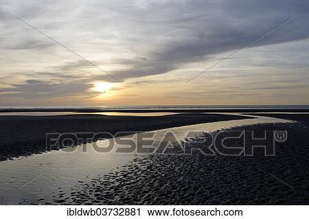 Sunset Over A Beach At Low Tide English Channel Cote Dâ