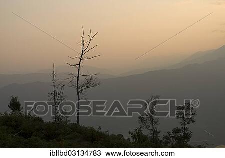 Stock Image - "Sunset over Annapurna range in clouds, Sarankot, Annapurna Region, Nepal, Asia". Fotosearch