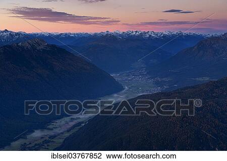 Stock Image - "Sunset over Imst and the Inn Valley, Ehrwald, Tyrol, Austria, Europe". Fotosearch
