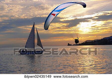 "Sunset over Lac Leman, Lake Geneva, with paragliders, Montreux, Switzerland, Europe" View Large Photo Image Stock Photo - "Sunset over Lac Leman, Lake Geneva, with paragliders, Montreux, Switzerland, Europe". Fotosearch