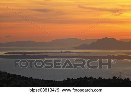 "Sunset over the Esterel Mountains, with Cap d'Antibes and the Iles de Lerins in the centre, seen from Mont Gros, Roquebrune Cap Martin, Departements Var and Alpes-Maritimes, Provence-Alpes-Cote d'Azur, France, Europe" View Large Photo Image Stock Photo - "Sunset over the Esterel Mountains, with Cap d'Antibes and the Iles de Lerins in the centre, seen from Mont Gros, Roquebrune Cap Martin, Departements Var and Alpes-Maritimes, Provence-Alpes-Cote d'Azur, France, Europe". Fotosearch